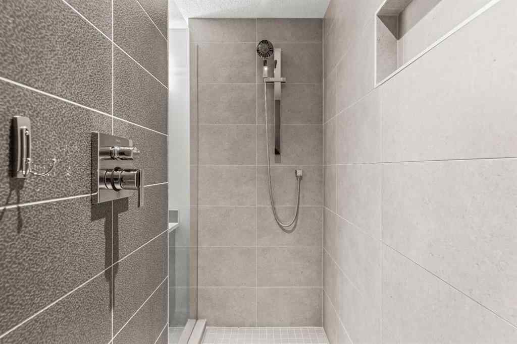 MLS® A2262139 - Unit #204 105 Stewart Creek Rise SW in Three Sisters Canmore, Residential