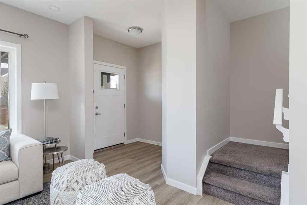 MLS® A2262289 - 25 Sunrise Way  in Sunset Ridge Cochrane, Residential