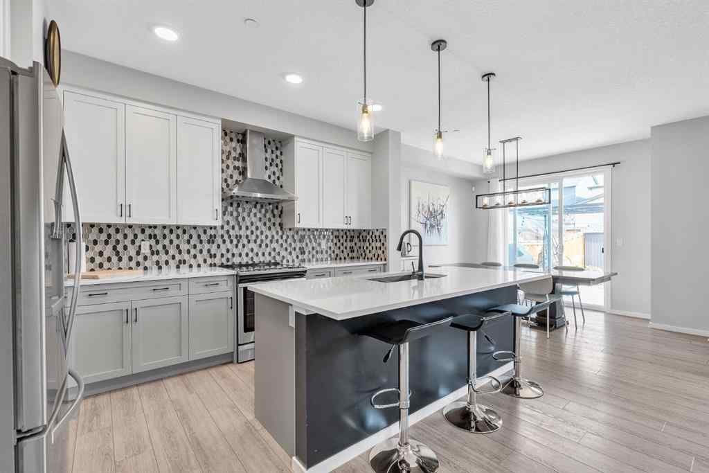 MLS® A2262302 - 98 Lucas Crescent NW in Livingston Calgary, Residential