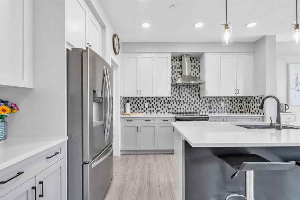 MLS® A2262302 - 98 Lucas Crescent NW in Livingston Calgary, Residential