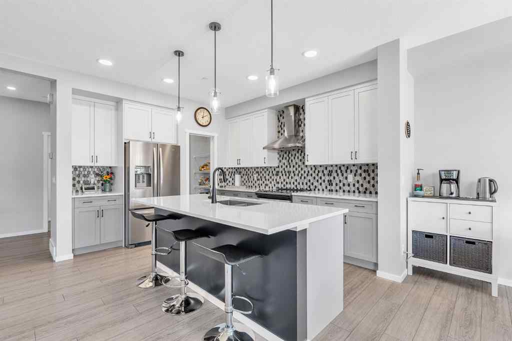 MLS® A2262302 - 98 Lucas Crescent NW in Livingston Calgary, Residential