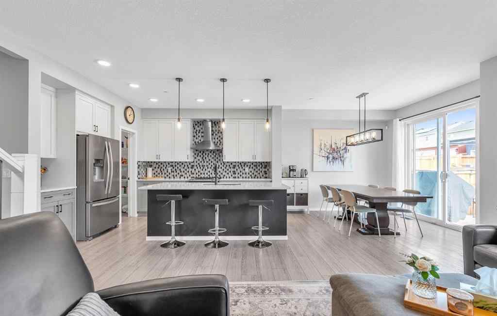 MLS® A2262302 - 98 Lucas Crescent NW in Livingston Calgary, Residential