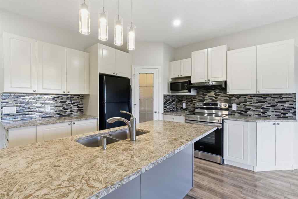 MLS® A2262348 - 64 Cougarstone Square SW in Cougar Ridge Calgary, Residential
