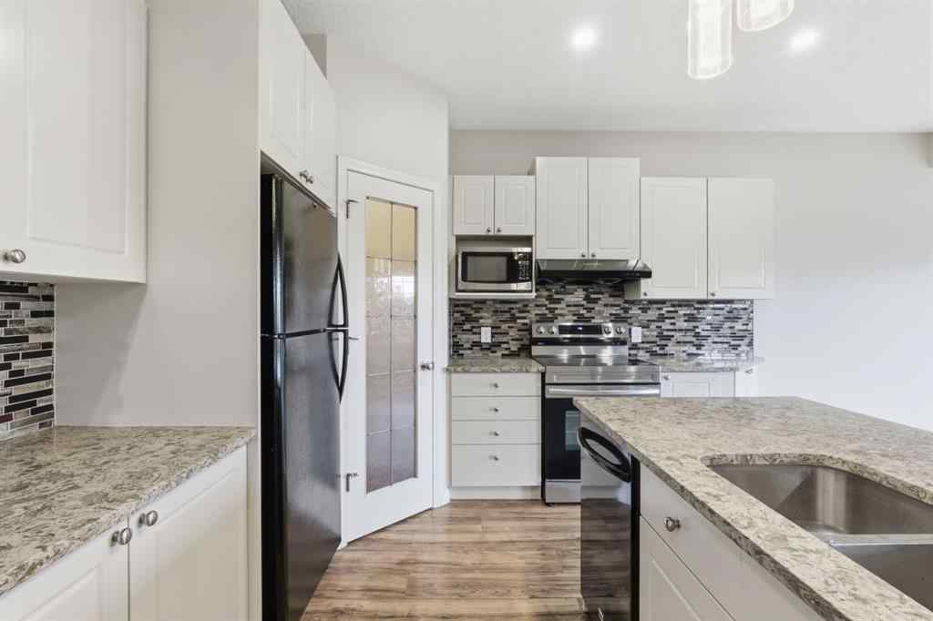 MLS® A2262348 - 64 Cougarstone Square SW in Cougar Ridge Calgary, Residential