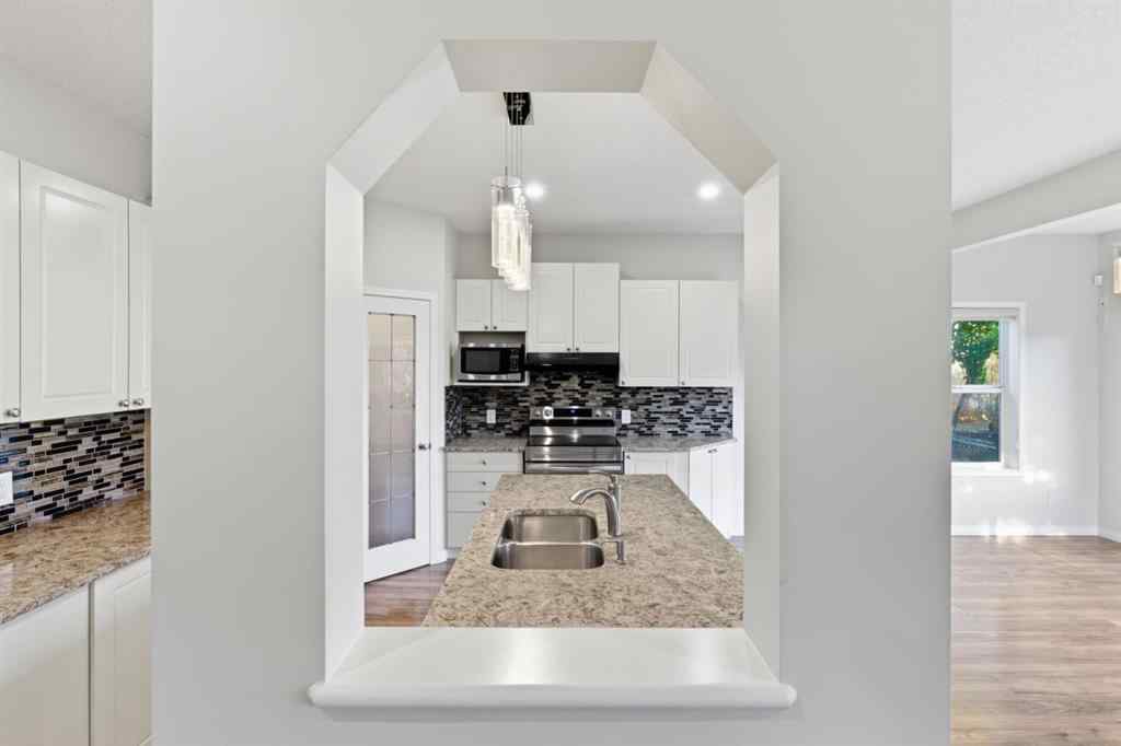 MLS® A2262348 - 64 Cougarstone Square SW in Cougar Ridge Calgary, Residential