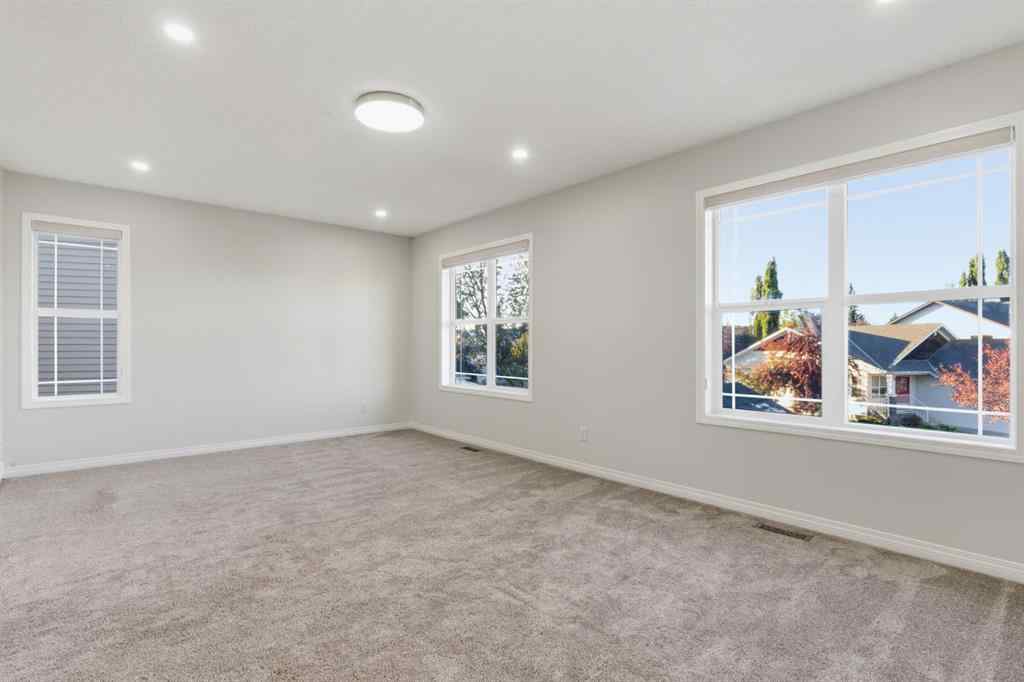 MLS® A2262348 - 64 Cougarstone Square SW in Cougar Ridge Calgary, Residential