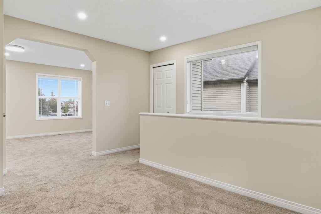 MLS® A2262348 - 64 Cougarstone Square SW in Cougar Ridge Calgary, Residential