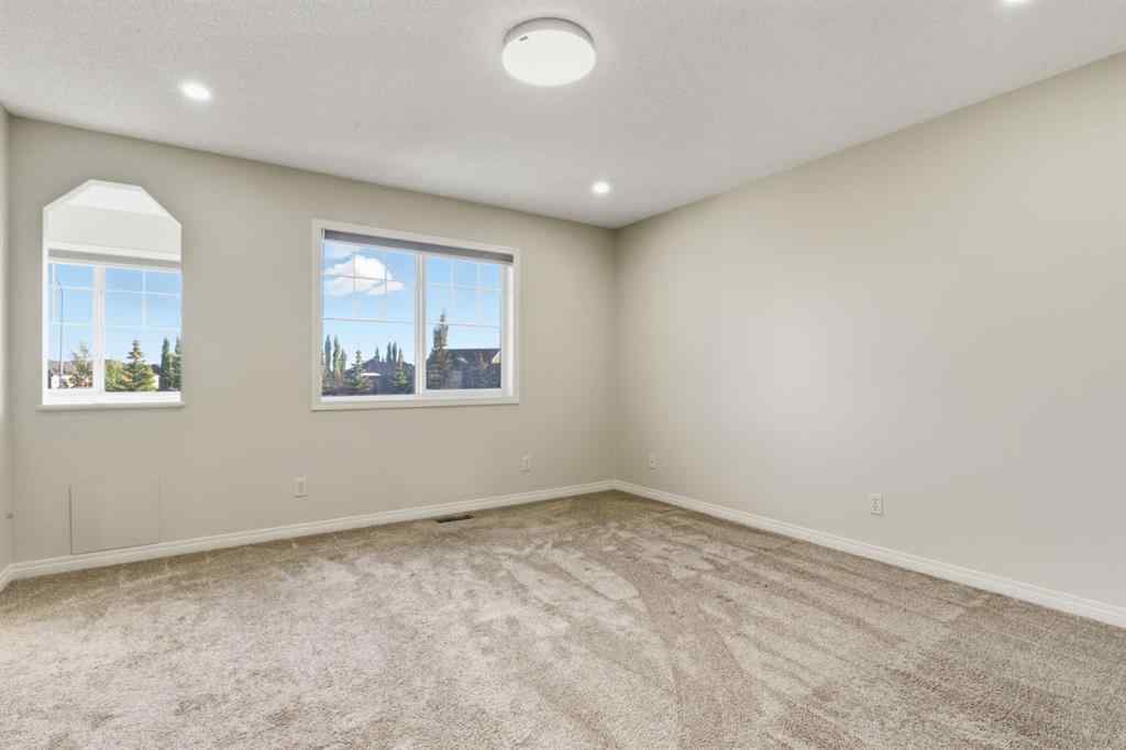 MLS® A2262348 - 64 Cougarstone Square SW in Cougar Ridge Calgary, Residential