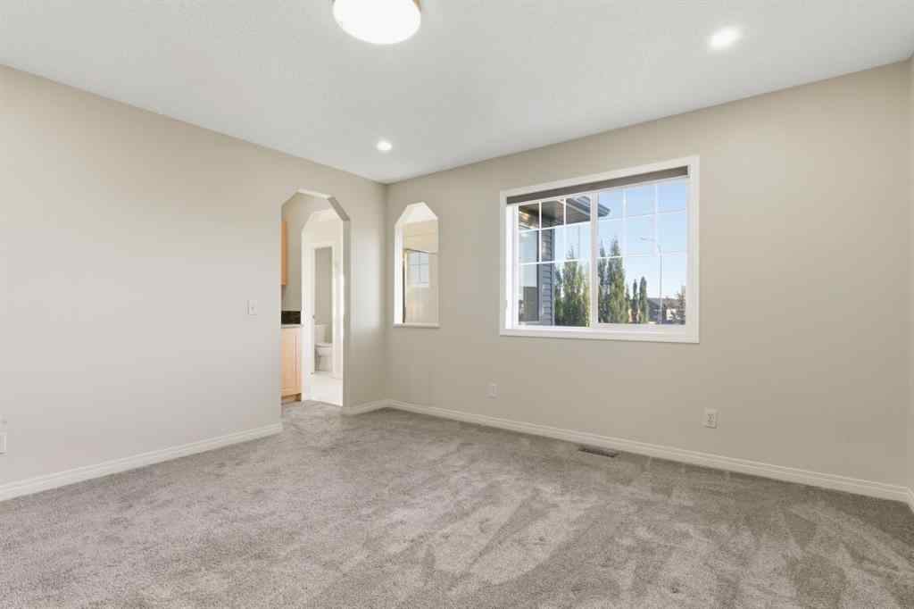 MLS® A2262348 - 64 Cougarstone Square SW in Cougar Ridge Calgary, Residential