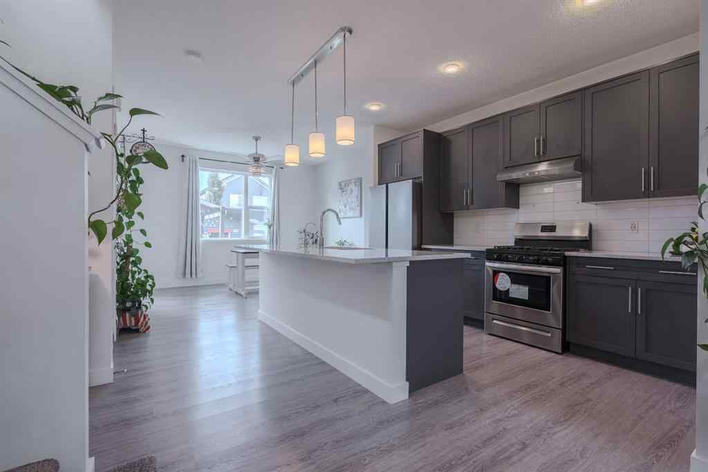 MLS® A2262360 - 239 Sundown Road  in Sunset Ridge Cochrane, Residential