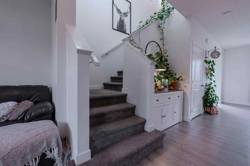 MLS® A2262360 - 239 Sundown Road  in Sunset Ridge Cochrane, Residential