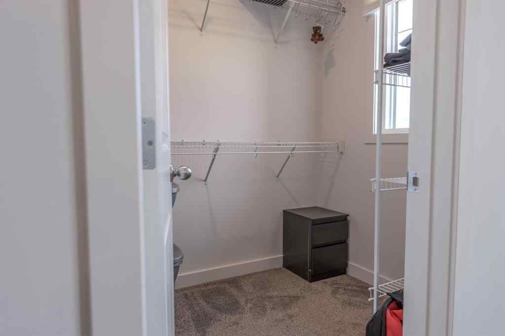 MLS® A2262360 - 239 Sundown Road  in Sunset Ridge Cochrane, Residential