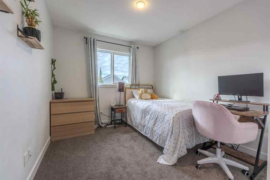 MLS® A2262360 - 239 Sundown Road  in Sunset Ridge Cochrane, Residential