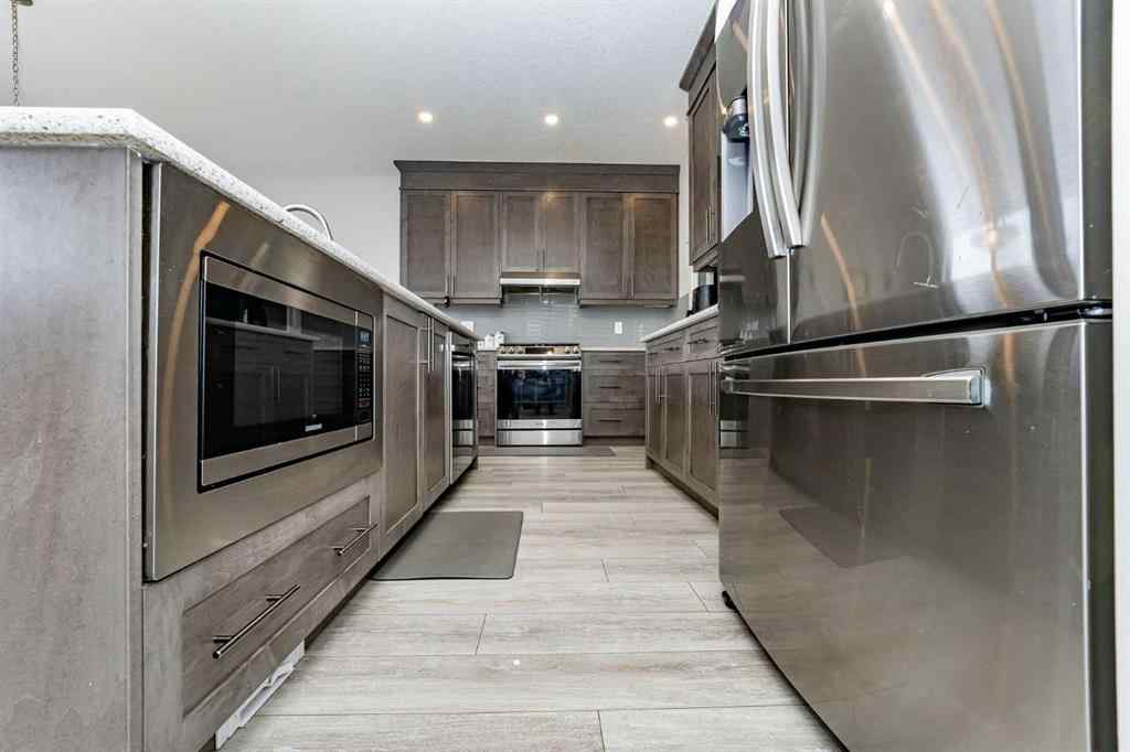 MLS® A2262371 - 717 Windrow Manor SW in South Windsong Airdrie, Residential