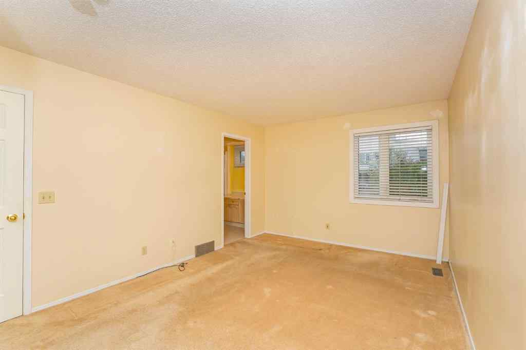 MLS® A2262406 - 215 Coachway Lane SW in Coach Hill Calgary, Residential