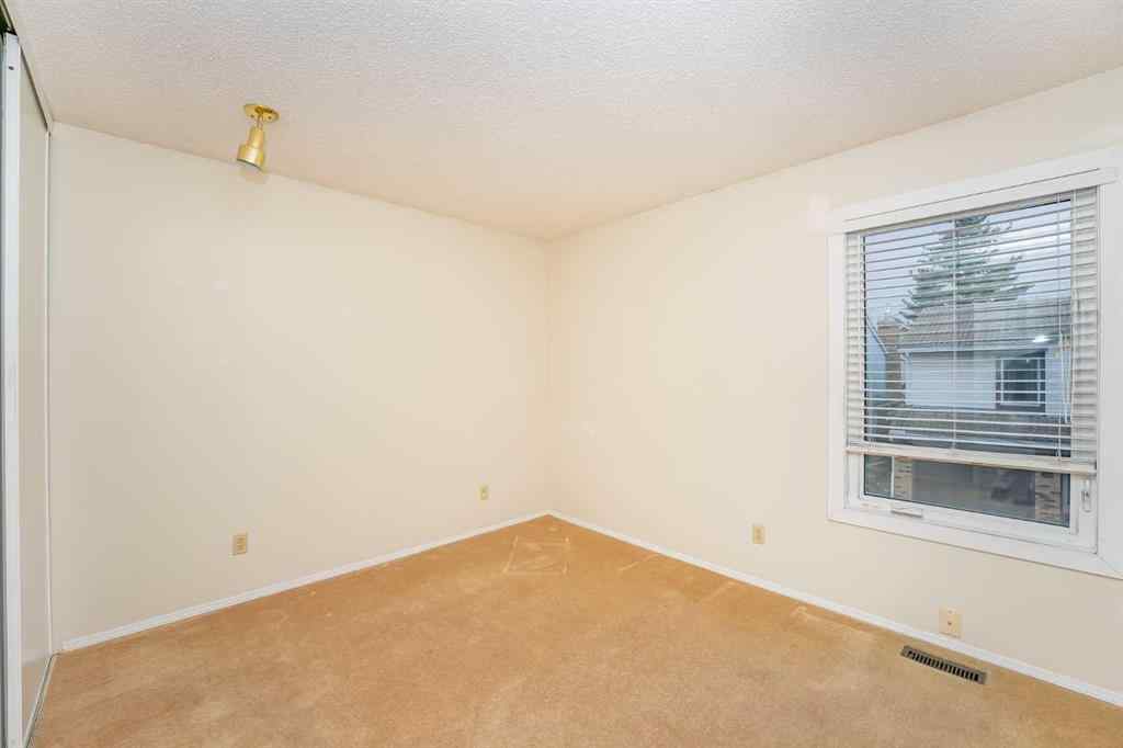 MLS® A2262406 - 215 Coachway Lane SW in Coach Hill Calgary, Residential