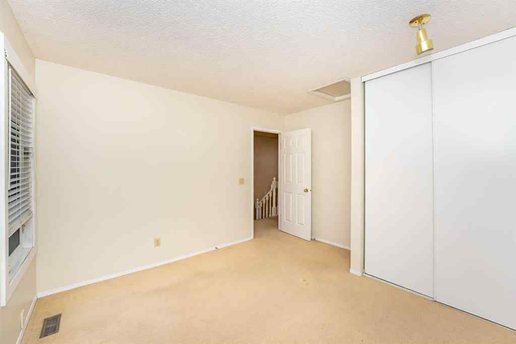 MLS® A2262406 - 215 Coachway Lane SW in Coach Hill Calgary, Residential