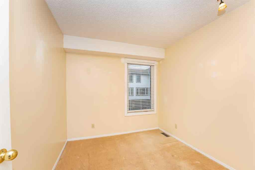 MLS® A2262406 - 215 Coachway Lane SW in Coach Hill Calgary, Residential