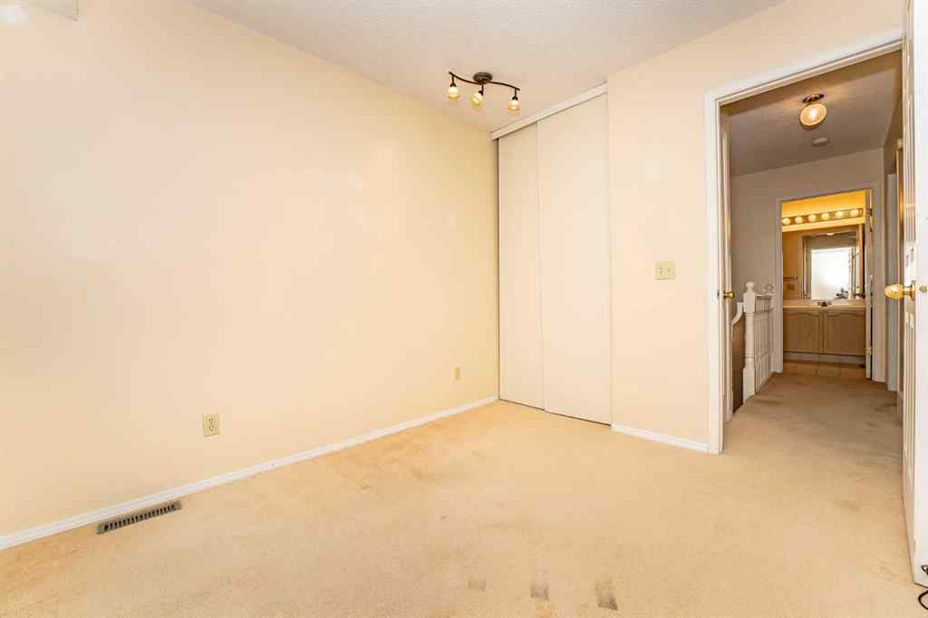 MLS® A2262406 - 215 Coachway Lane SW in Coach Hill Calgary, Residential