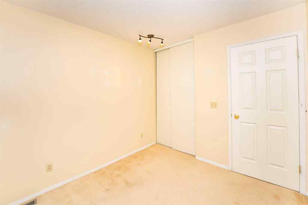 MLS® A2262406 - 215 Coachway Lane SW in Coach Hill Calgary, Residential