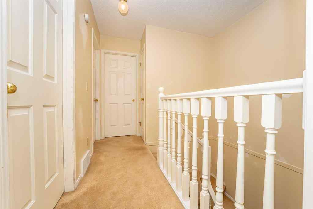 MLS® A2262406 - 215 Coachway Lane SW in Coach Hill Calgary, Residential