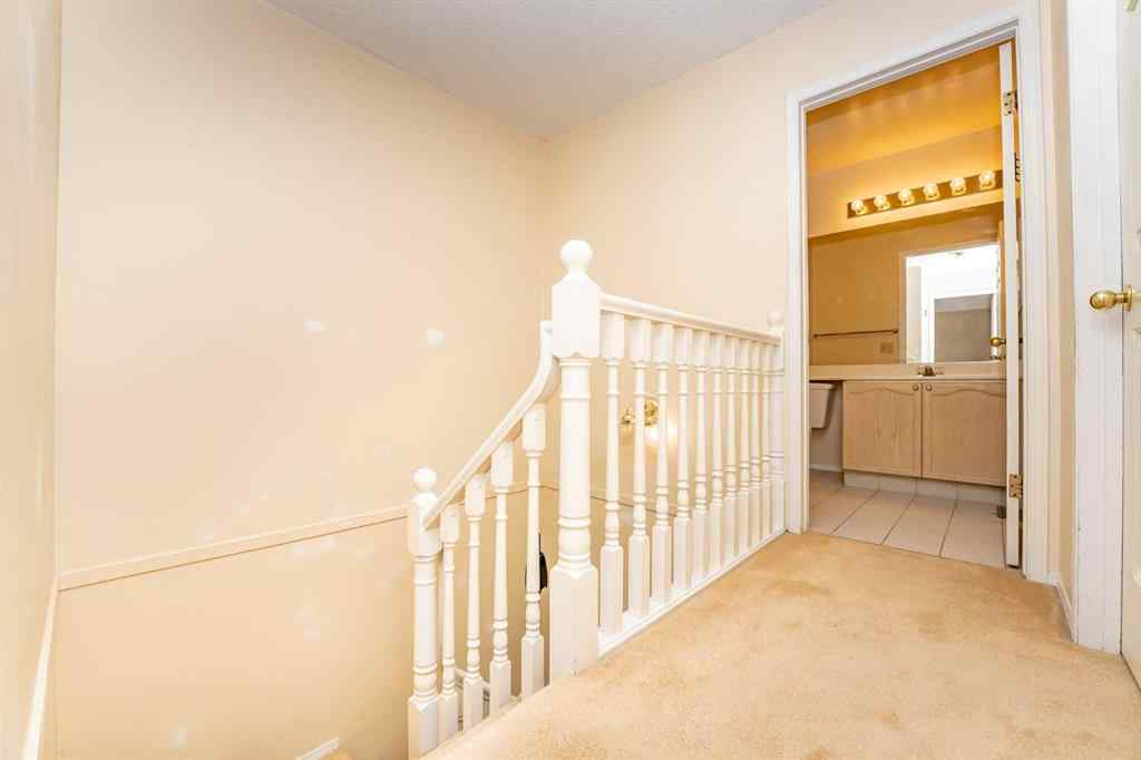 MLS® A2262406 - 215 Coachway Lane SW in Coach Hill Calgary, Residential