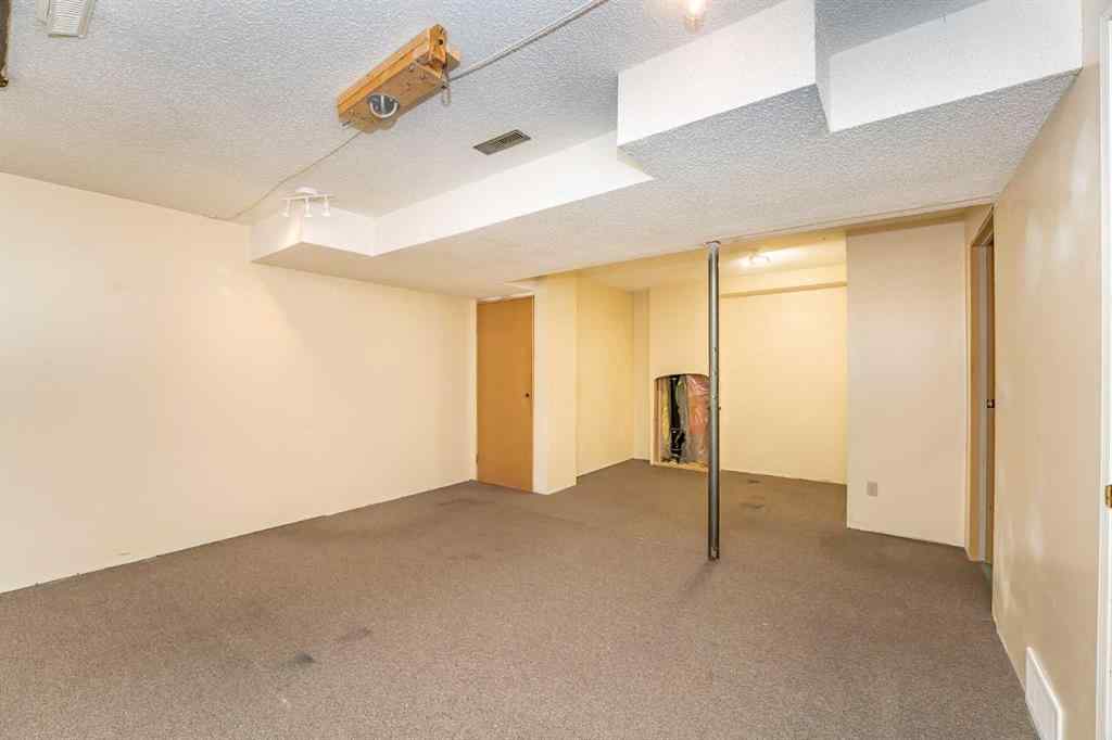 MLS® A2262406 - 215 Coachway Lane SW in Coach Hill Calgary, Residential