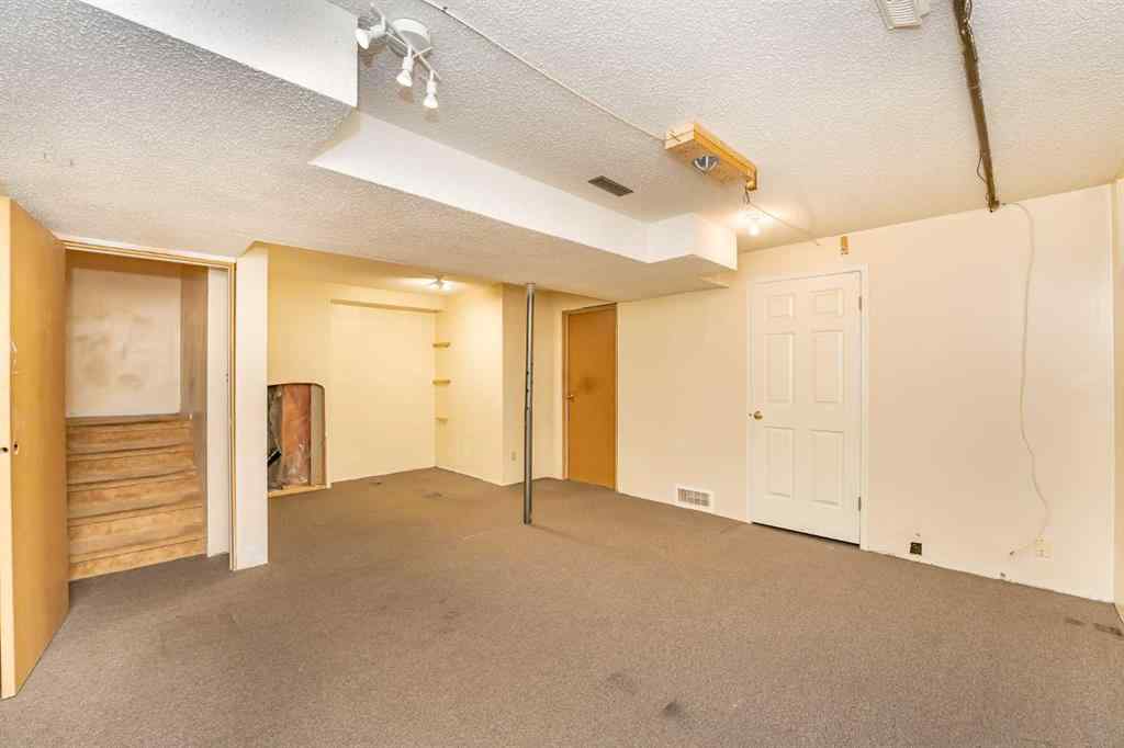 MLS® A2262406 - 215 Coachway Lane SW in Coach Hill Calgary, Residential