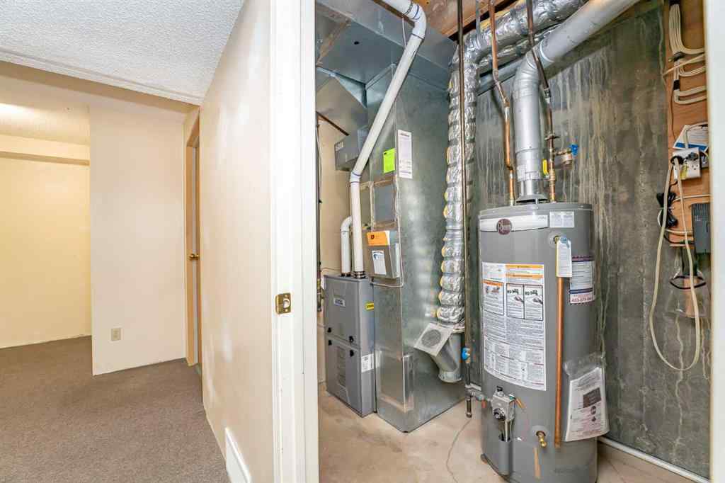 MLS® A2262406 - 215 Coachway Lane SW in Coach Hill Calgary, Residential