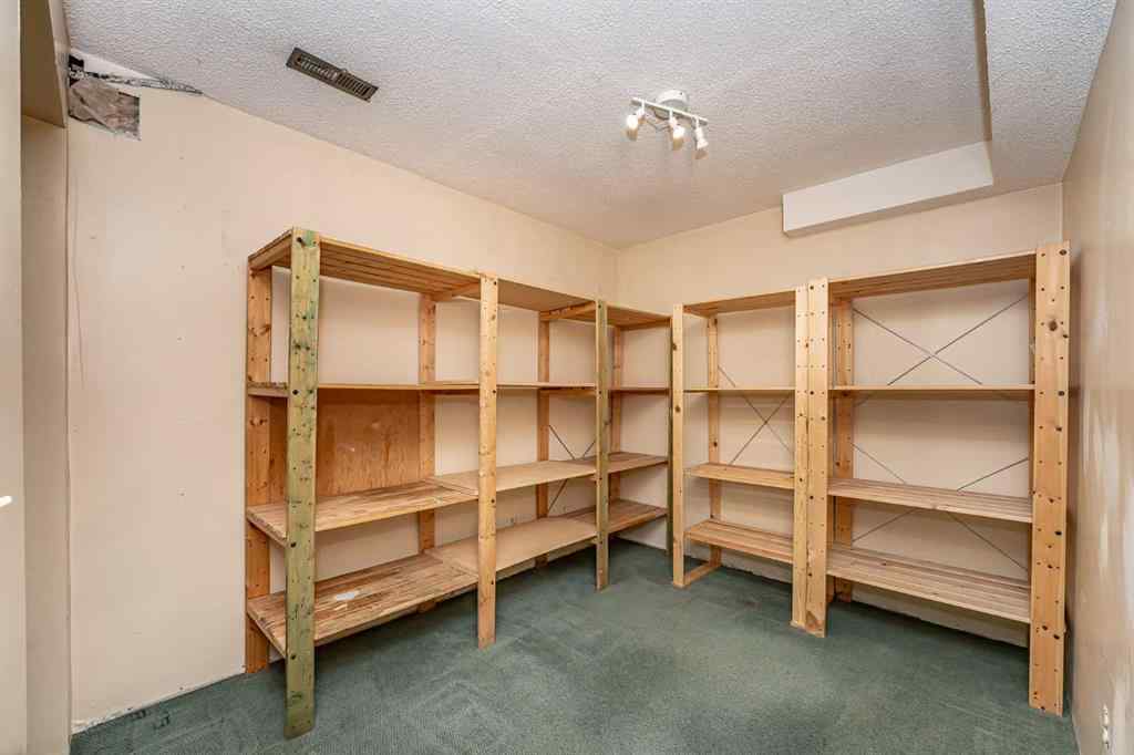 MLS® A2262406 - 215 Coachway Lane SW in Coach Hill Calgary, Residential