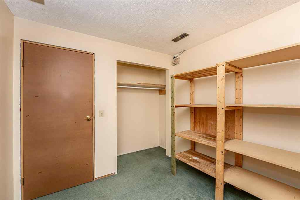 MLS® A2262406 - 215 Coachway Lane SW in Coach Hill Calgary, Residential