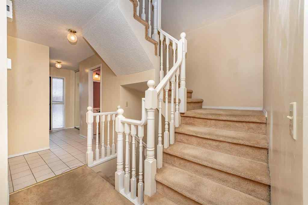 MLS® A2262406 - 215 Coachway Lane SW in Coach Hill Calgary, Residential