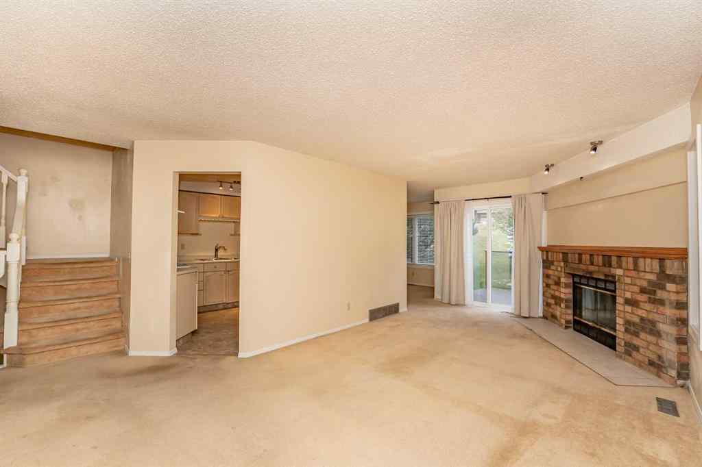 MLS® A2262406 - 215 Coachway Lane SW in Coach Hill Calgary, Residential