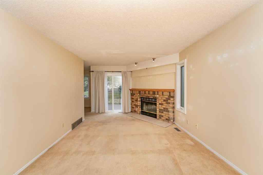 MLS® A2262406 - 215 Coachway Lane SW in Coach Hill Calgary, Residential