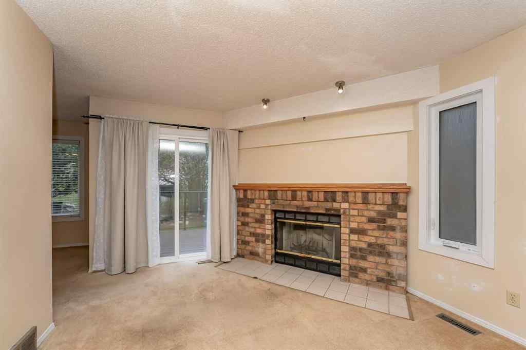 MLS® A2262406 - 215 Coachway Lane SW in Coach Hill Calgary, Residential