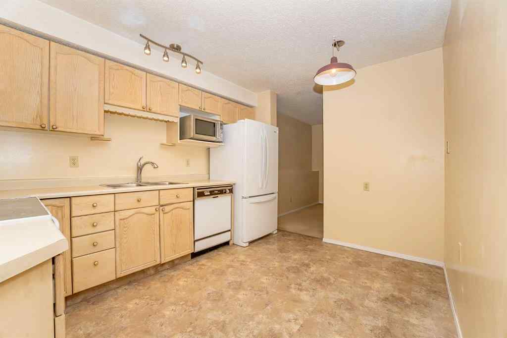 MLS® A2262406 - 215 Coachway Lane SW in Coach Hill Calgary, Residential