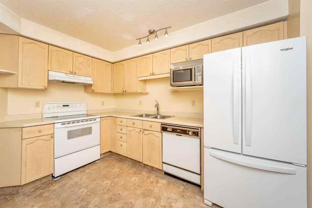 MLS® A2262406 - 215 Coachway Lane SW in Coach Hill Calgary, Residential