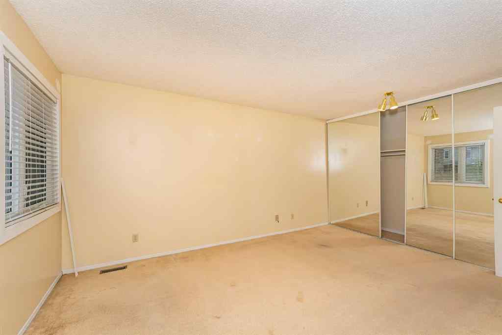 MLS® A2262406 - 215 Coachway Lane SW in Coach Hill Calgary, Residential