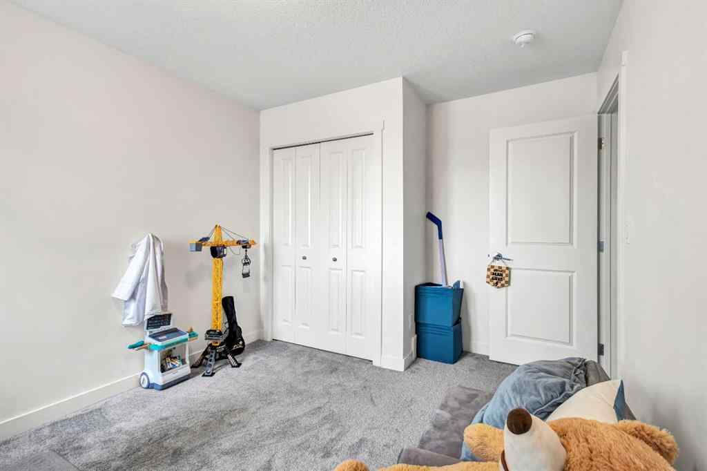 MLS® A2262412 - 890 Bluerock Way SW in Alpine Park Calgary, Residential