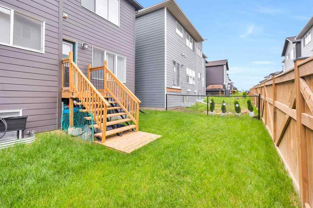 MLS® A2262412 - 890 Bluerock Way SW in Alpine Park Calgary, Residential