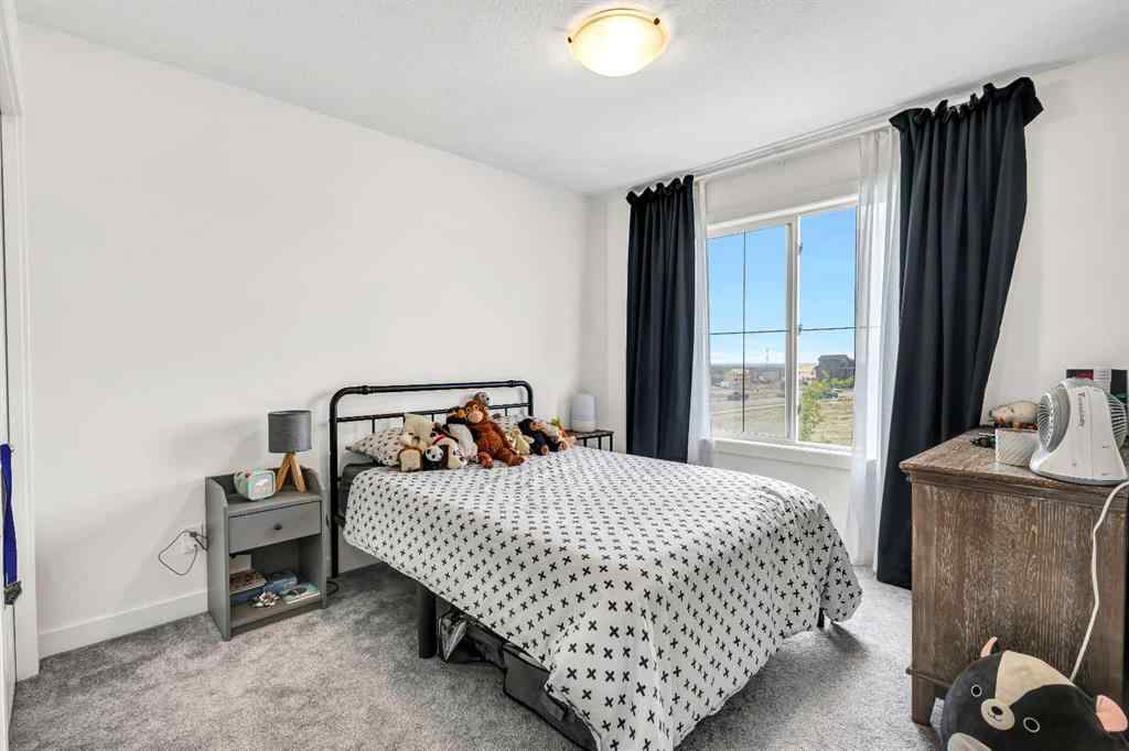 MLS® A2262412 - 890 Bluerock Way SW in Alpine Park Calgary, Residential