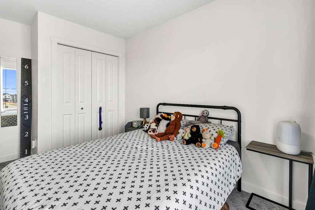 MLS® A2262412 - 890 Bluerock Way SW in Alpine Park Calgary, Residential