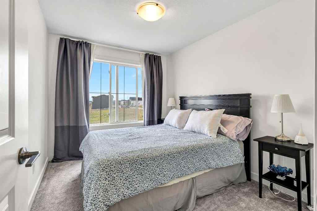 MLS® A2262412 - 890 Bluerock Way SW in Alpine Park Calgary, Residential
