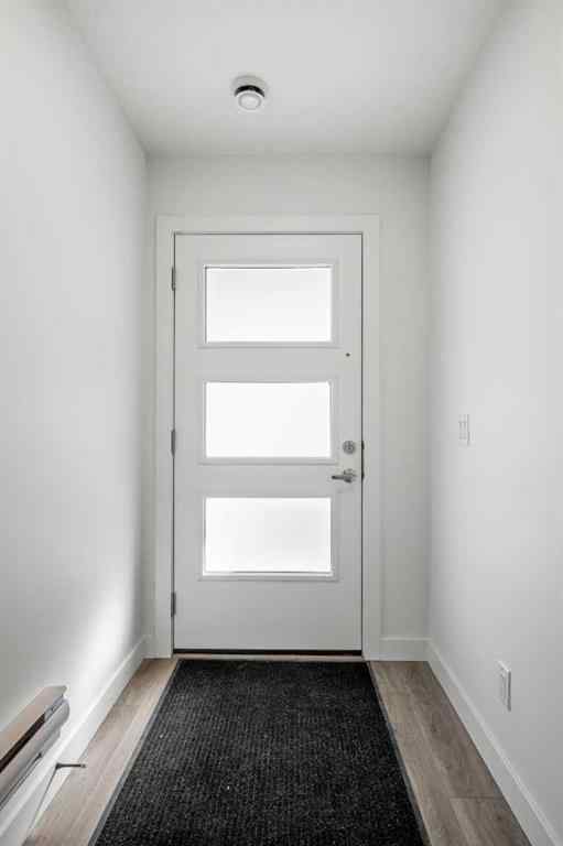 MLS® A2262499 - Unit #116 8235 8 Avenue SW in West Springs Calgary, Residential