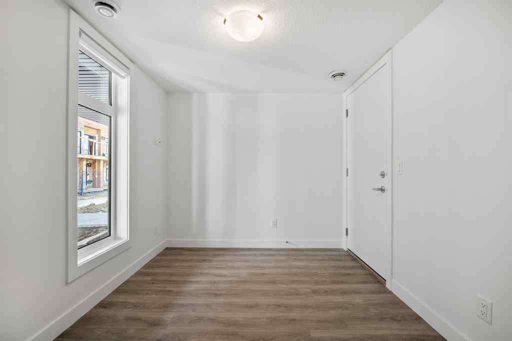 MLS® A2262499 - Unit #116 8235 8 Avenue SW in West Springs Calgary, Residential