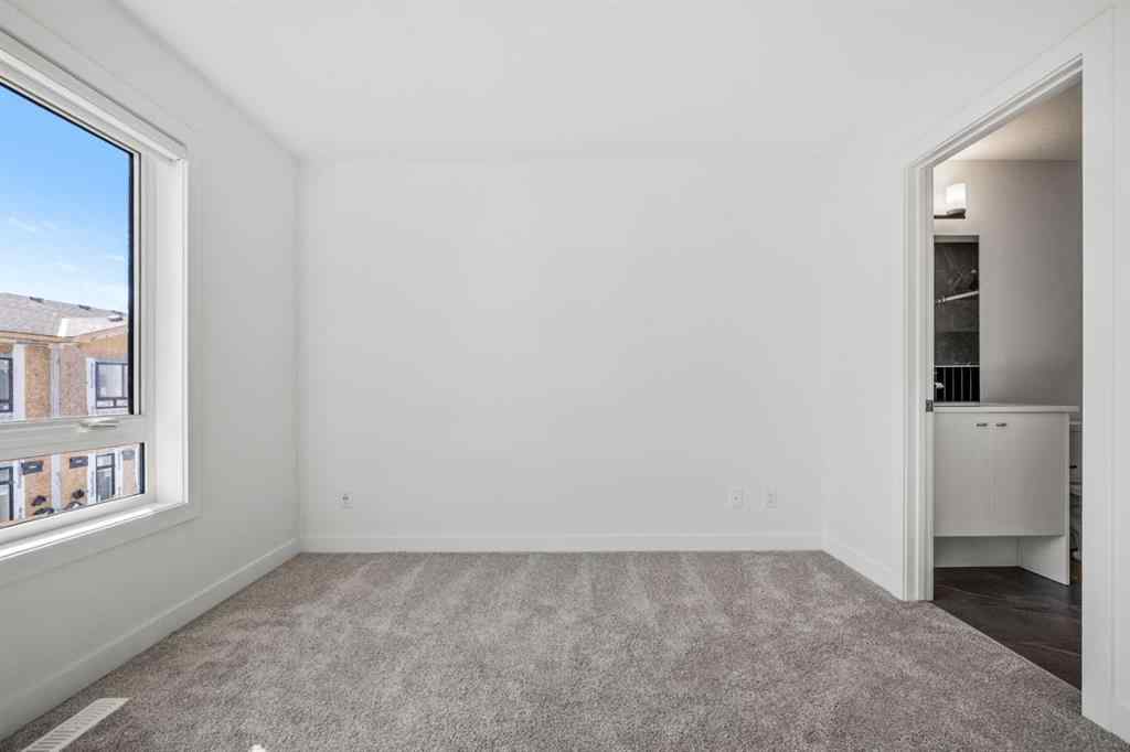 MLS® A2262499 - Unit #116 8235 8 Avenue SW in West Springs Calgary, Residential