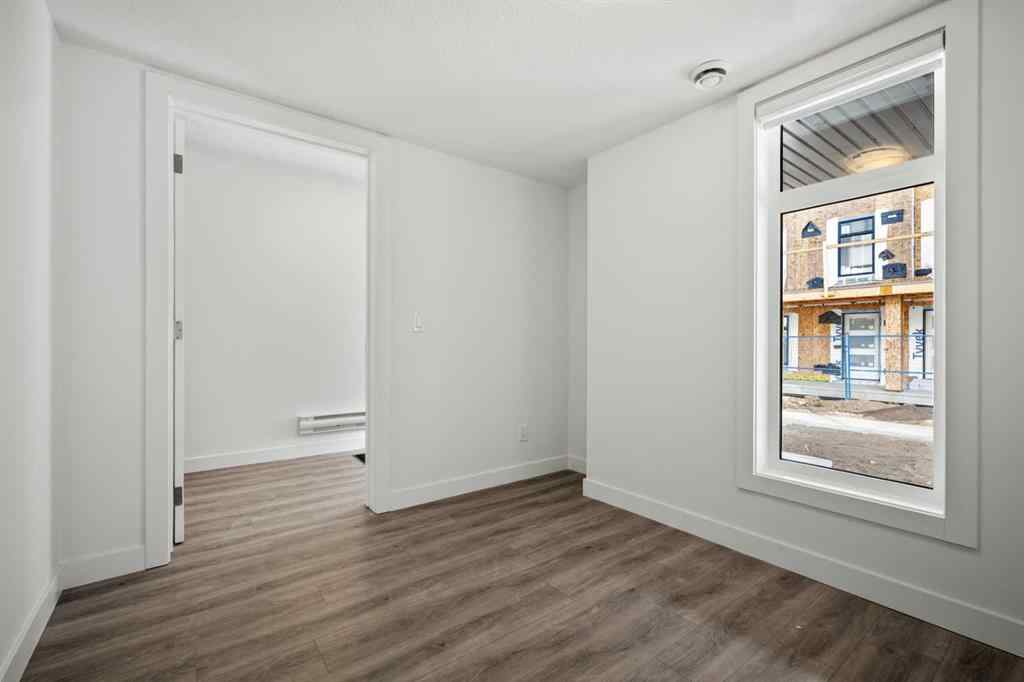 MLS® A2262499 - Unit #116 8235 8 Avenue SW in West Springs Calgary, Residential