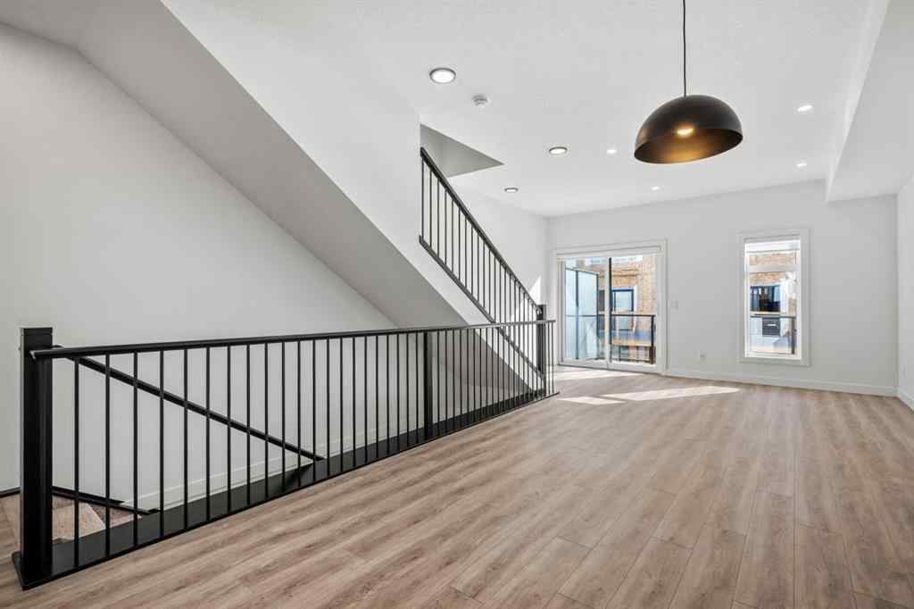 MLS® A2262499 - Unit #116 8235 8 Avenue SW in West Springs Calgary, Residential