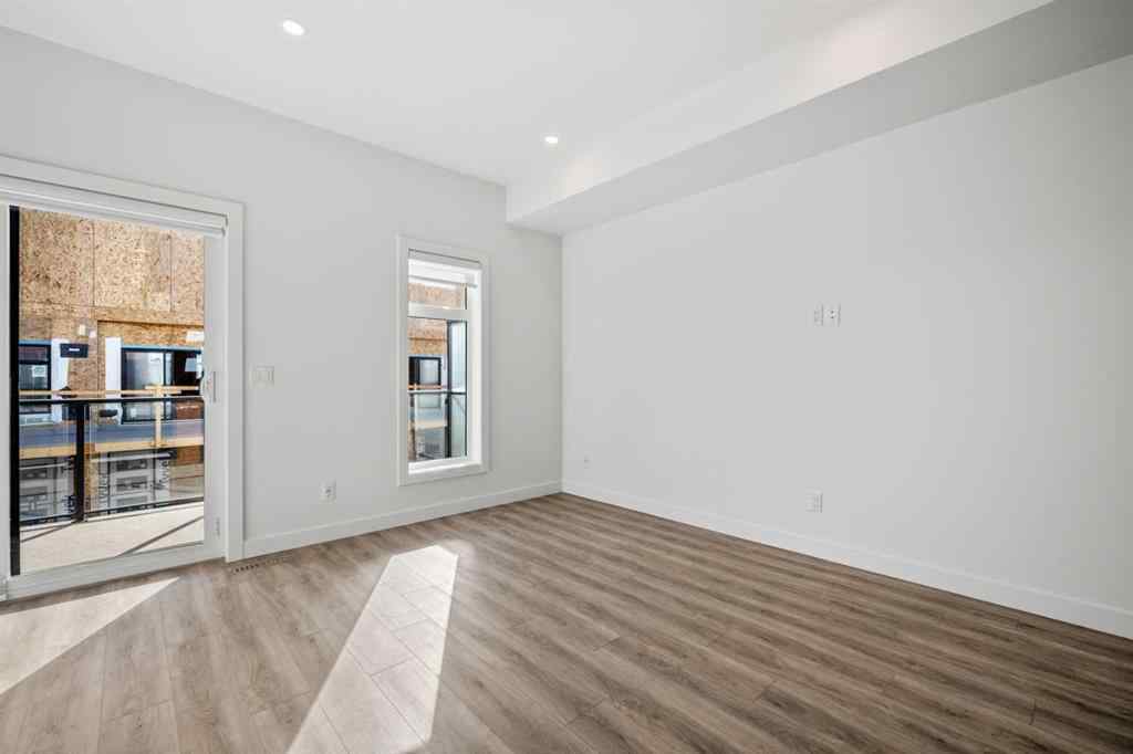 MLS® A2262499 - Unit #116 8235 8 Avenue SW in West Springs Calgary, Residential