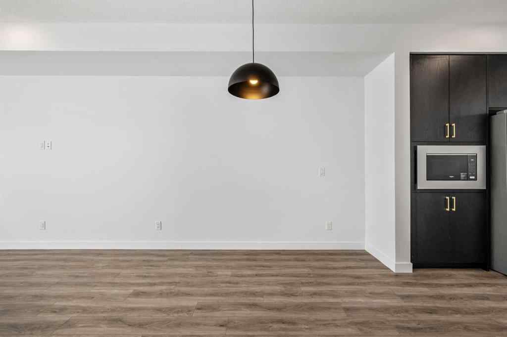 MLS® A2262499 - Unit #116 8235 8 Avenue SW in West Springs Calgary, Residential